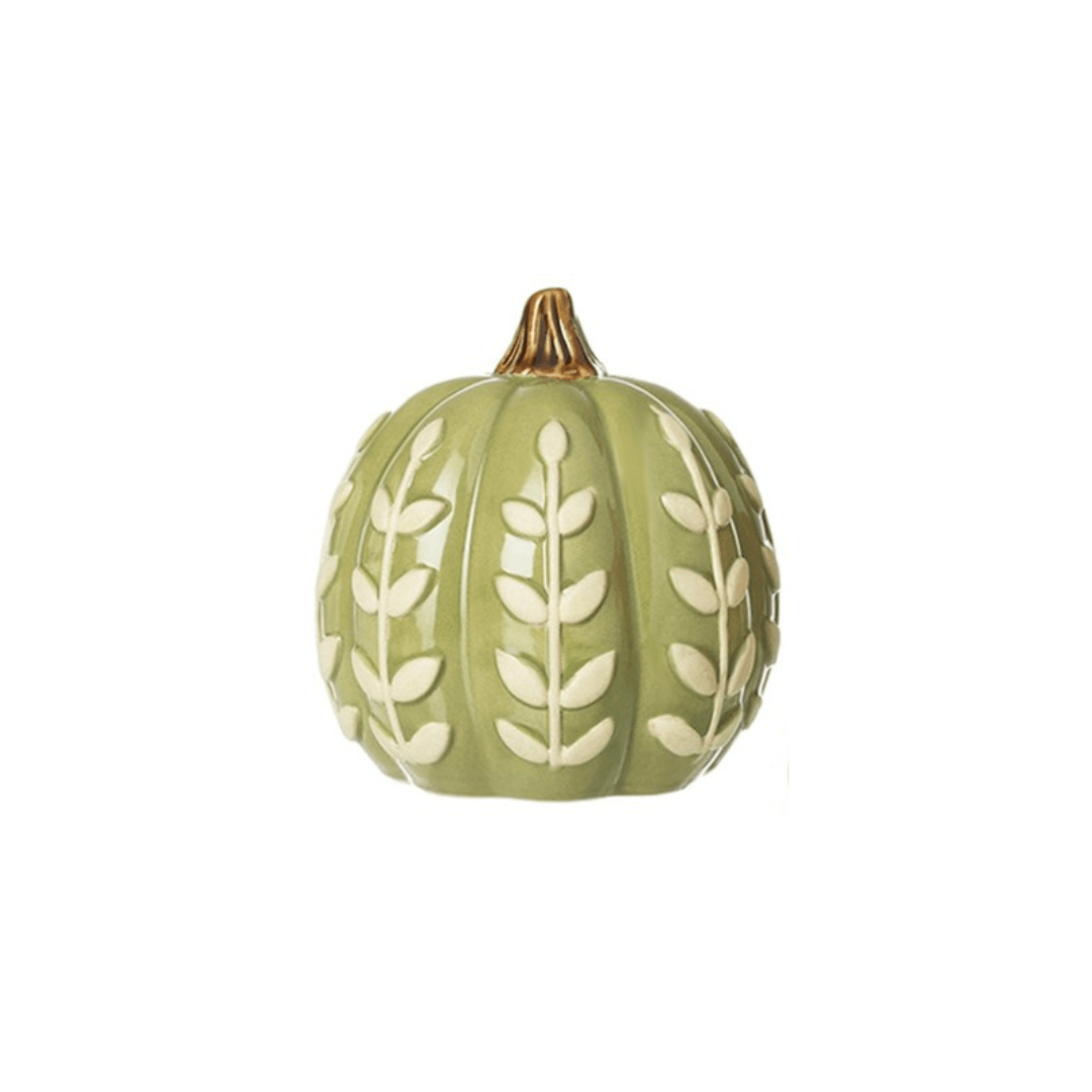 Decorative green pumpkin with white leaf patterns on a white background