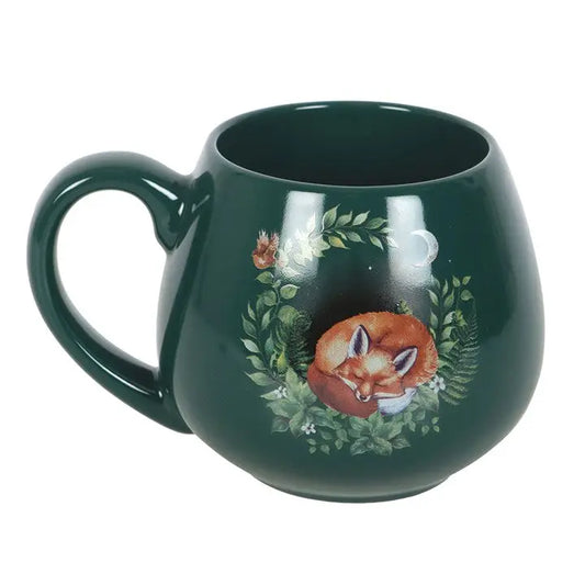 Green mug with a fox design on a white background