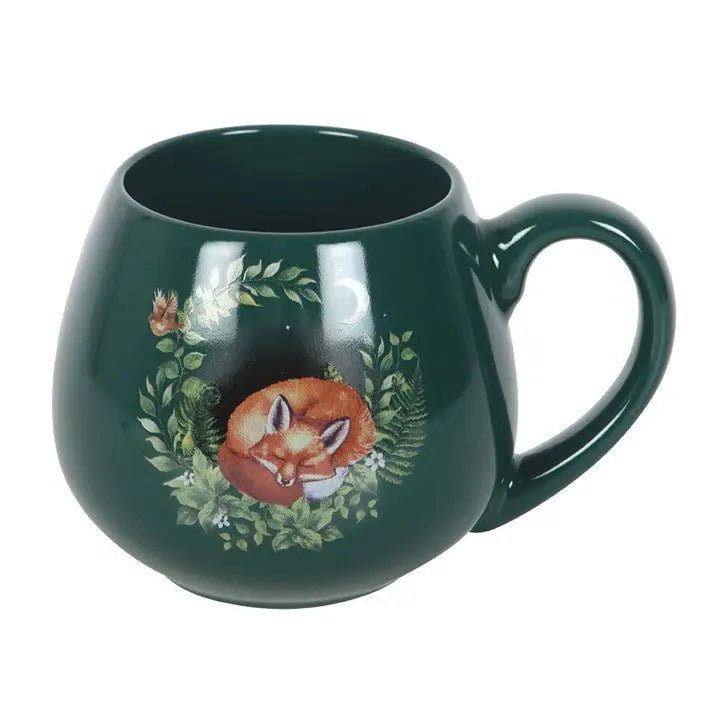 Green mug with a fox design on a white background