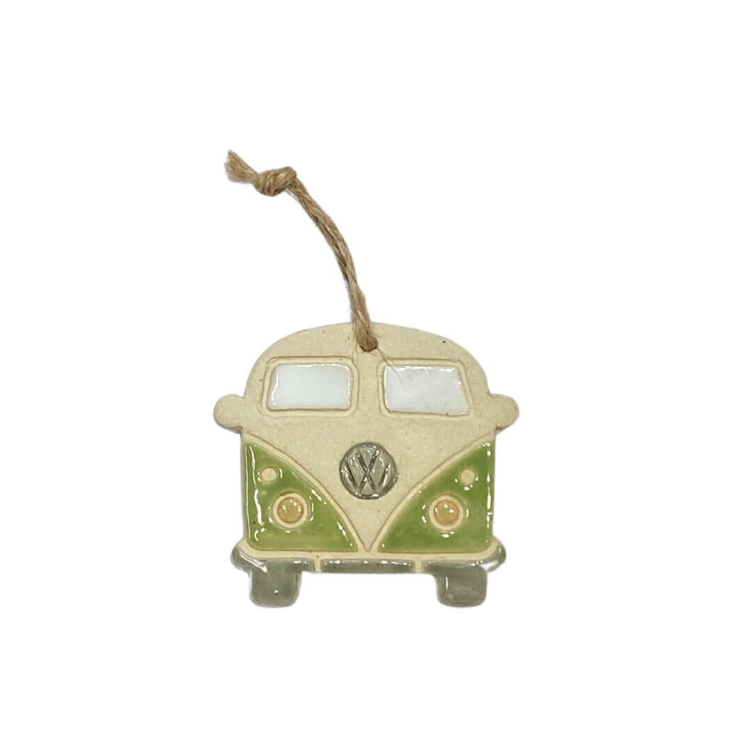 A ceramic decoration in the shape of a retro VW camper van, hanging from a string.