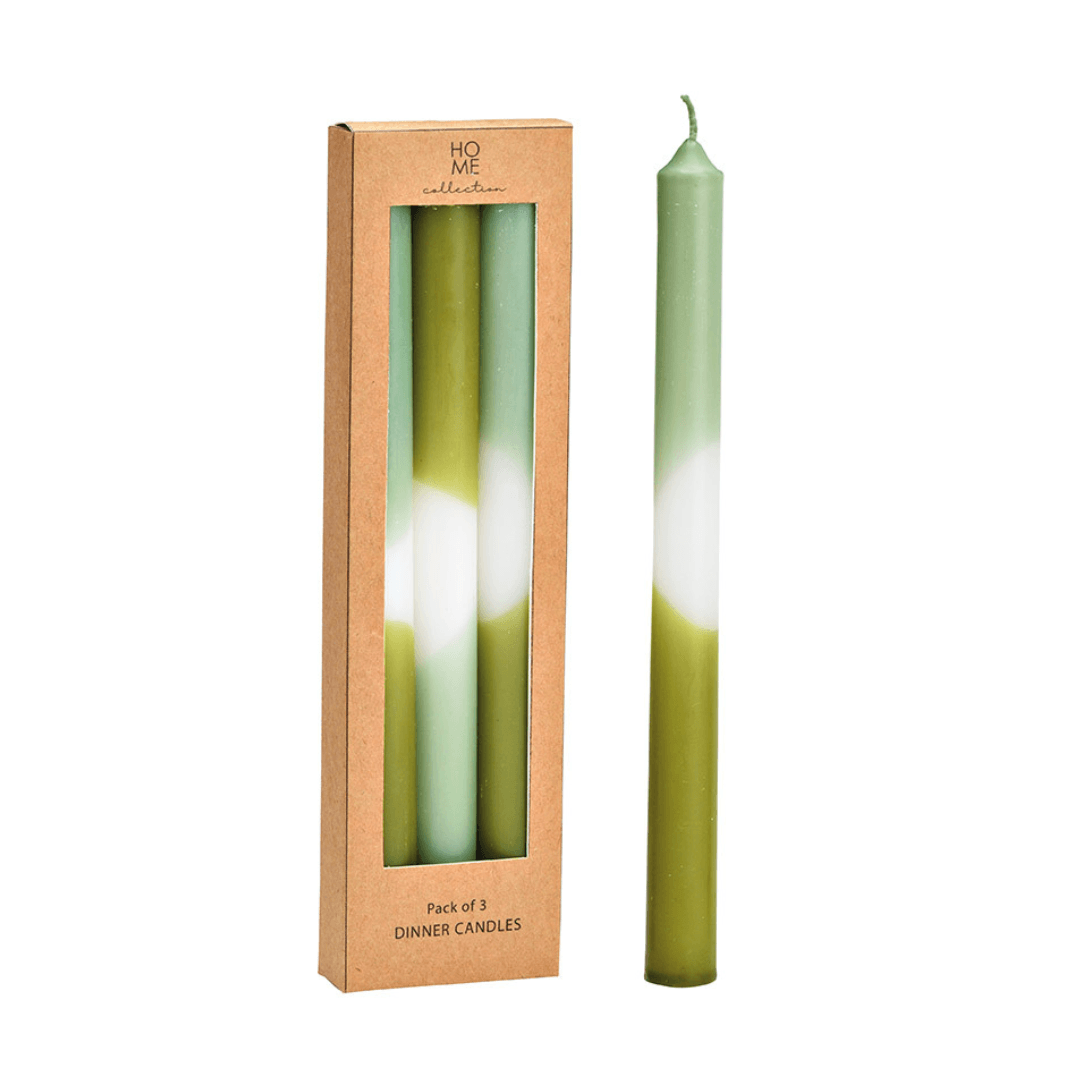 Green dinner candle with packaging labeled 'Home Collection' on a white background