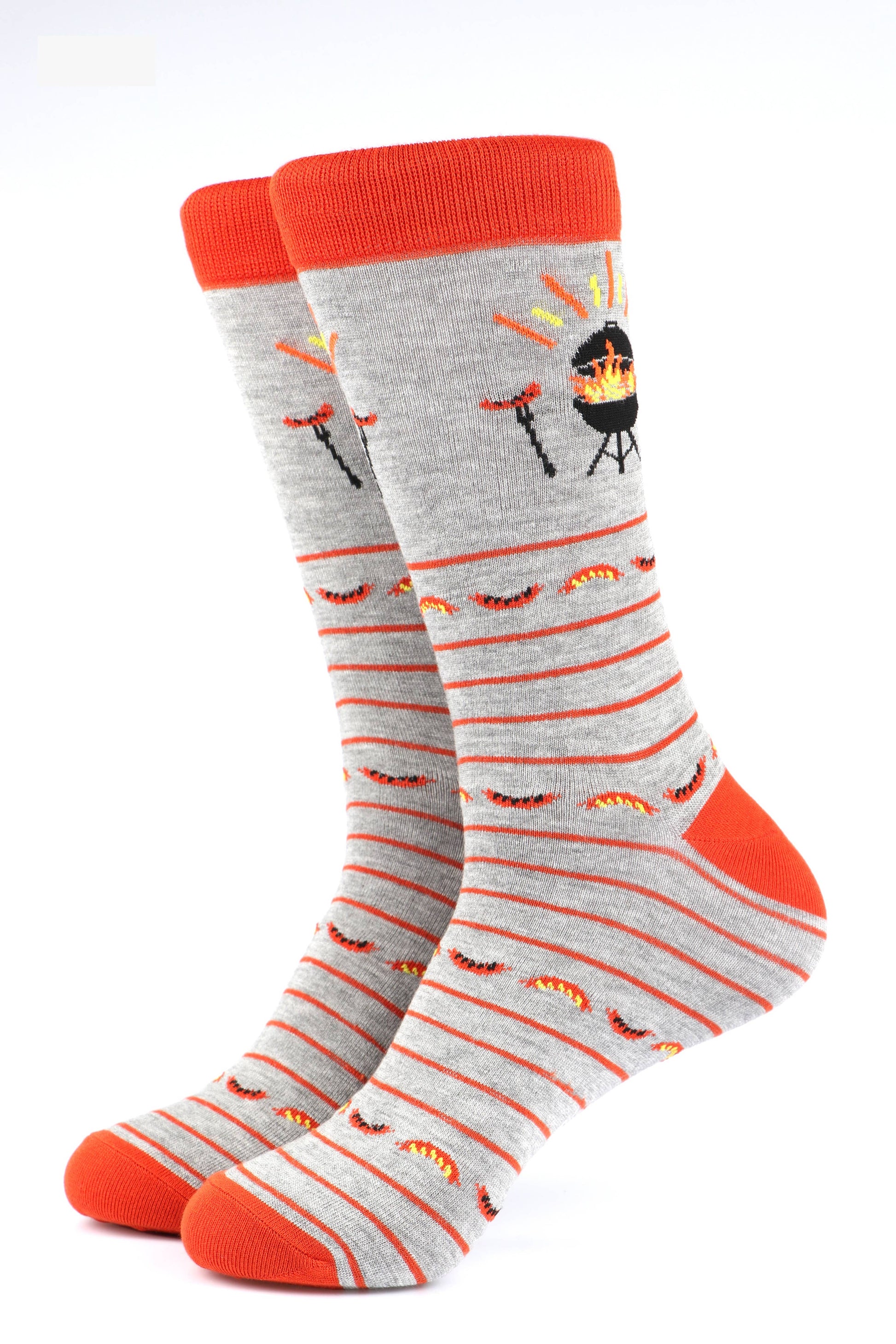 Gray socks with orange stripes and barbecue-themed design on a white background