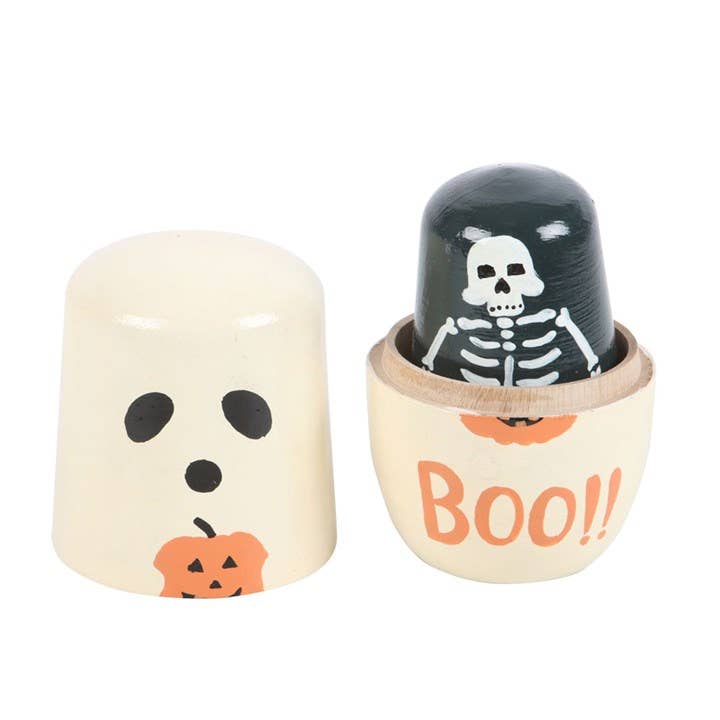 Halloween-themed wooden toy set with a skull and pumpkin design on a white background