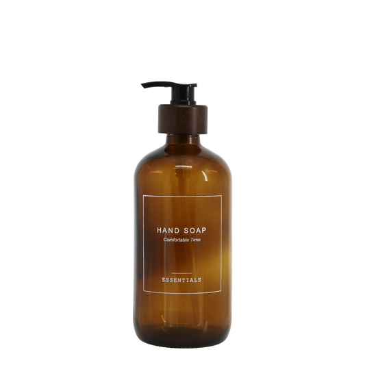 Brown hand soap bottle with pump on a white background