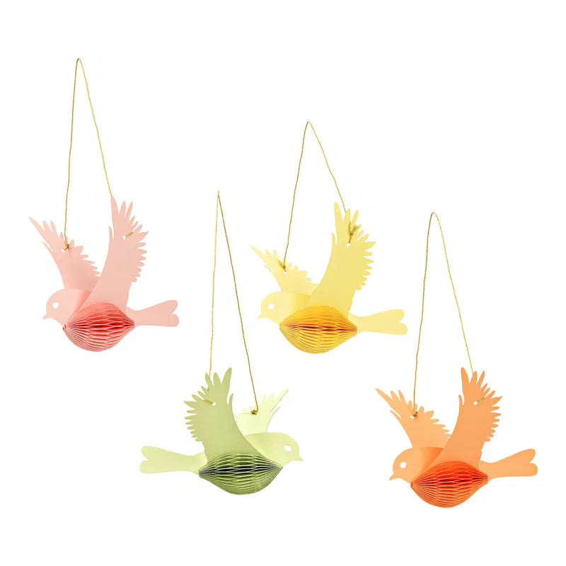 Set of four colorful bird-shaped decorations on a white background