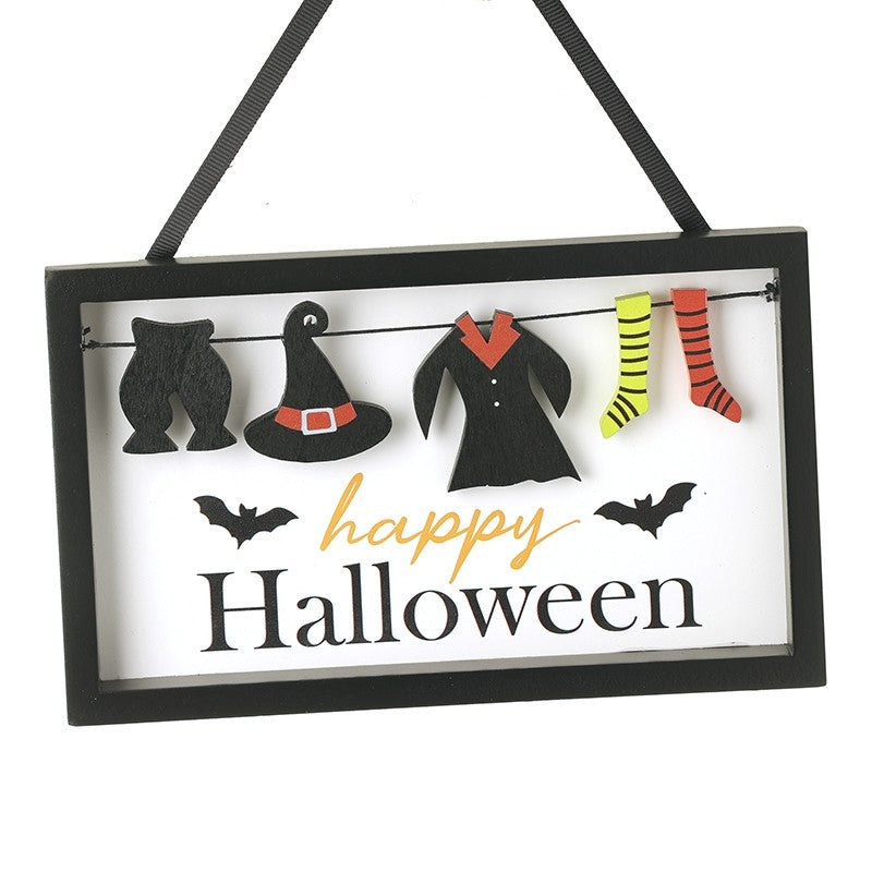 Hanging Halloween decoration with black bats, witch hat, coat, and striped socks on a white background.