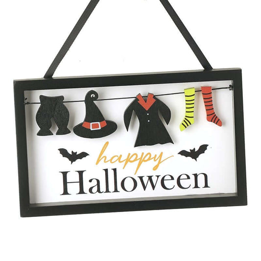 Hanging Halloween decoration with black bats, witch hat, coat, and striped socks on a white background.