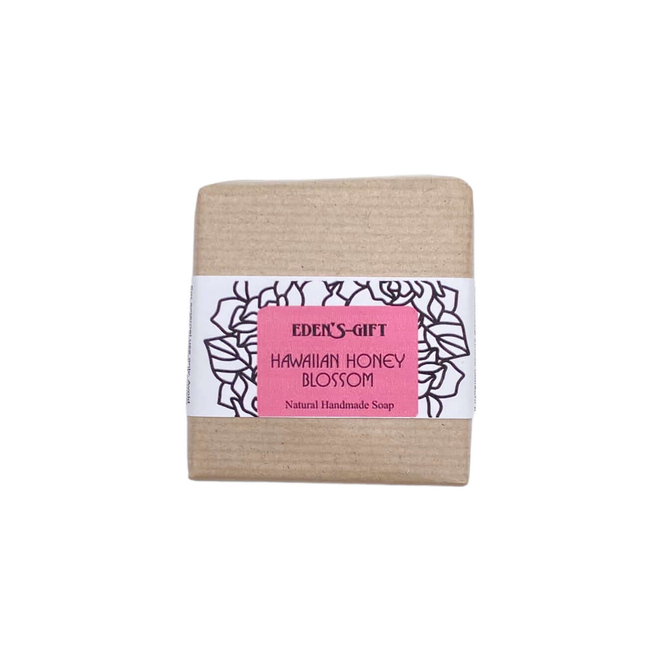 A bar of handmade soap with a label that reads 'Hawaiian Honey Blossom Natural Handmade Soap' from Eden's Gift.