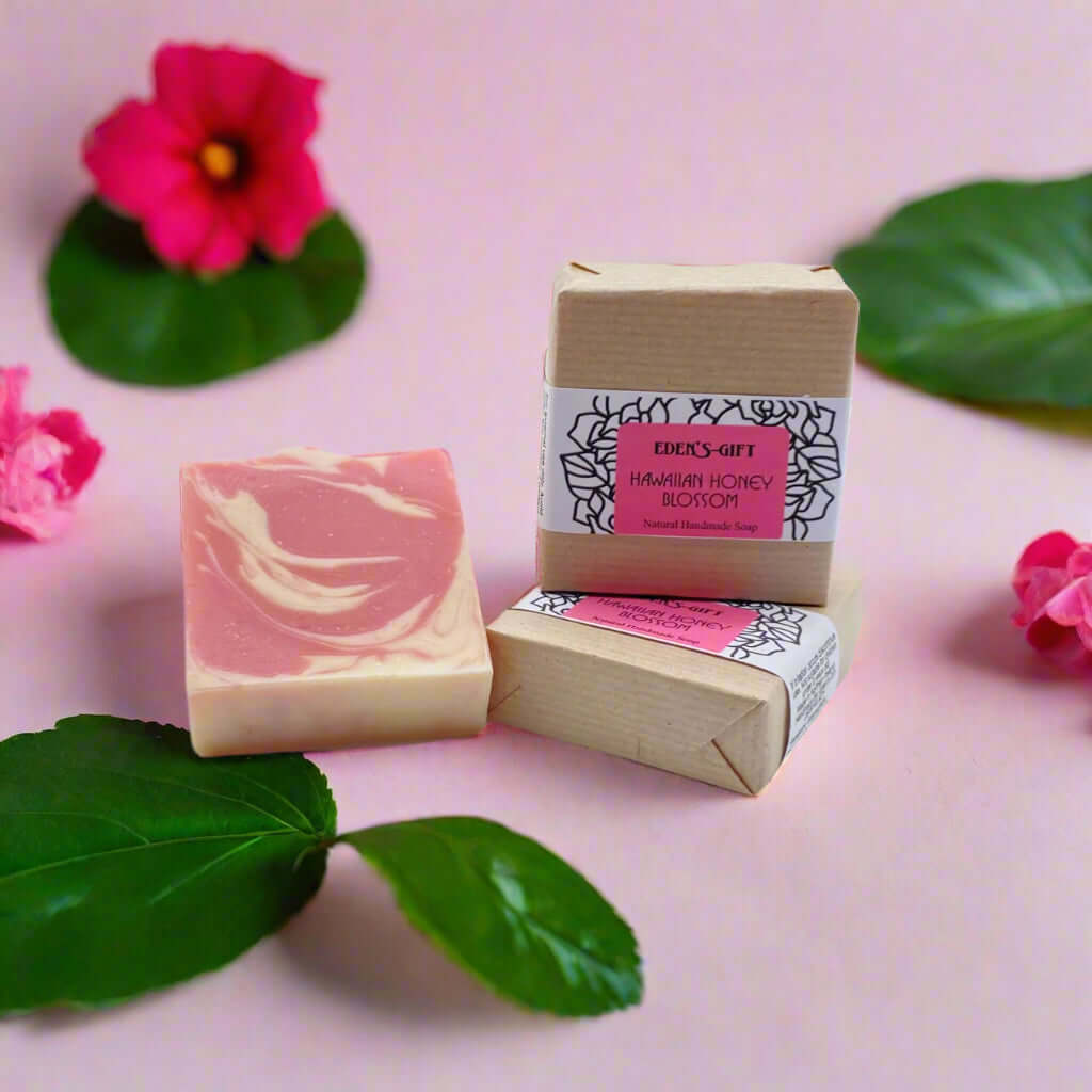 A bar of handmade soap with a label that reads 'Hawaiian Honey Blossom Natural Handmade Soap' from Eden's Gift.