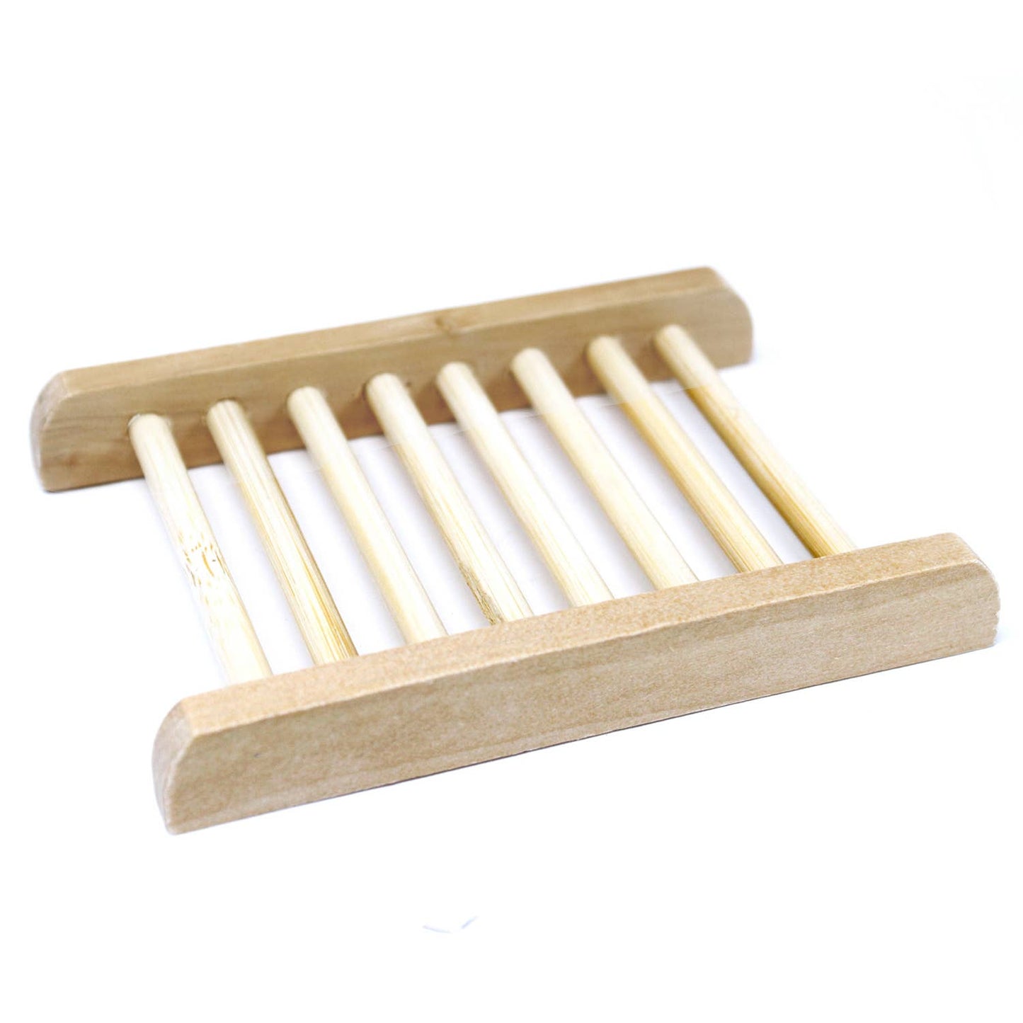 Wooden soap dish with slotted design on a white background