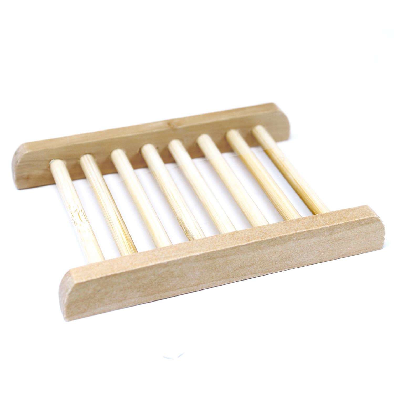 Wooden soap dish with slotted design on a white background