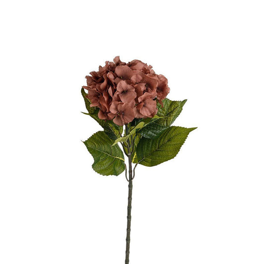 Artificial flower arrangement with brown flowers and green leaves on a white background