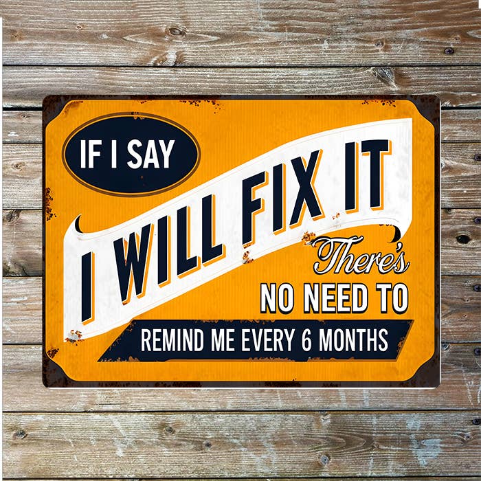 Metal sign with humorous text on a wooden background