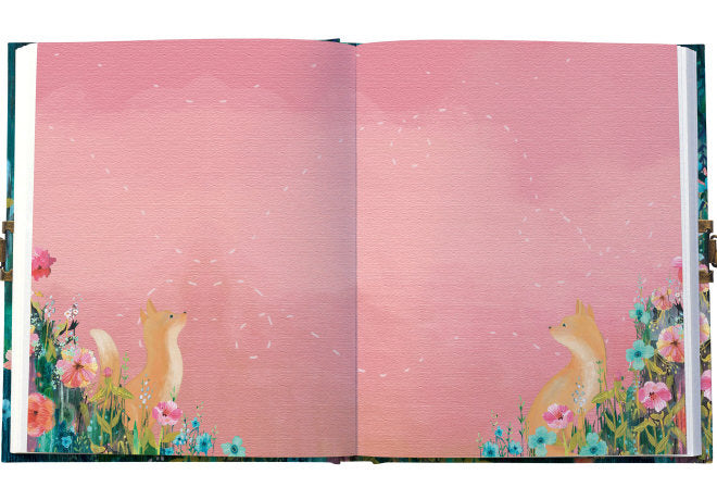 Open book with fox illustrations on a pink background
