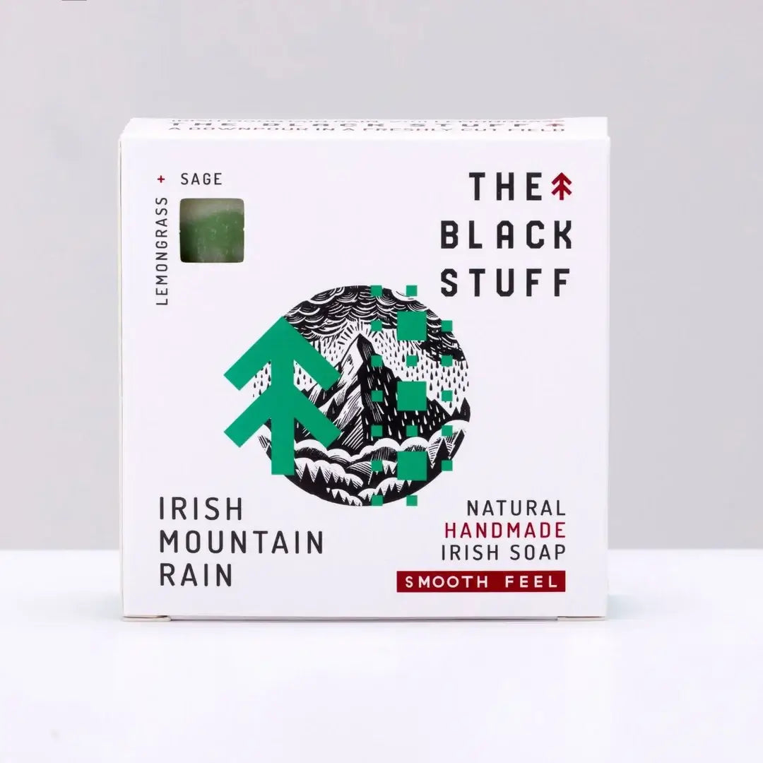 Packaging for 'The Black Stuff' Irish Mountain Rain bar soap, featuring the product name, a small amount of soap, and a rough feel description.