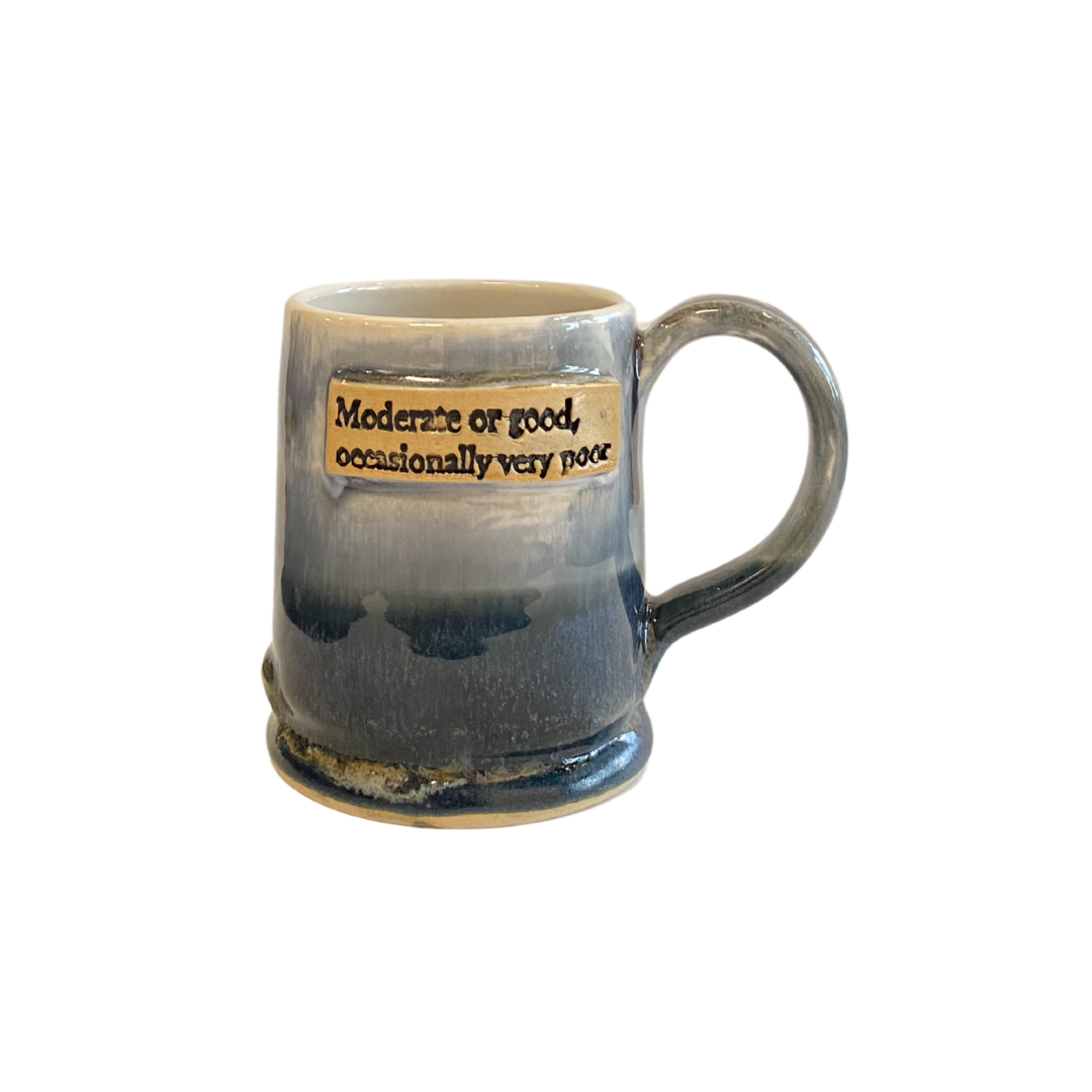 Blue ceramic mug with text on a white background