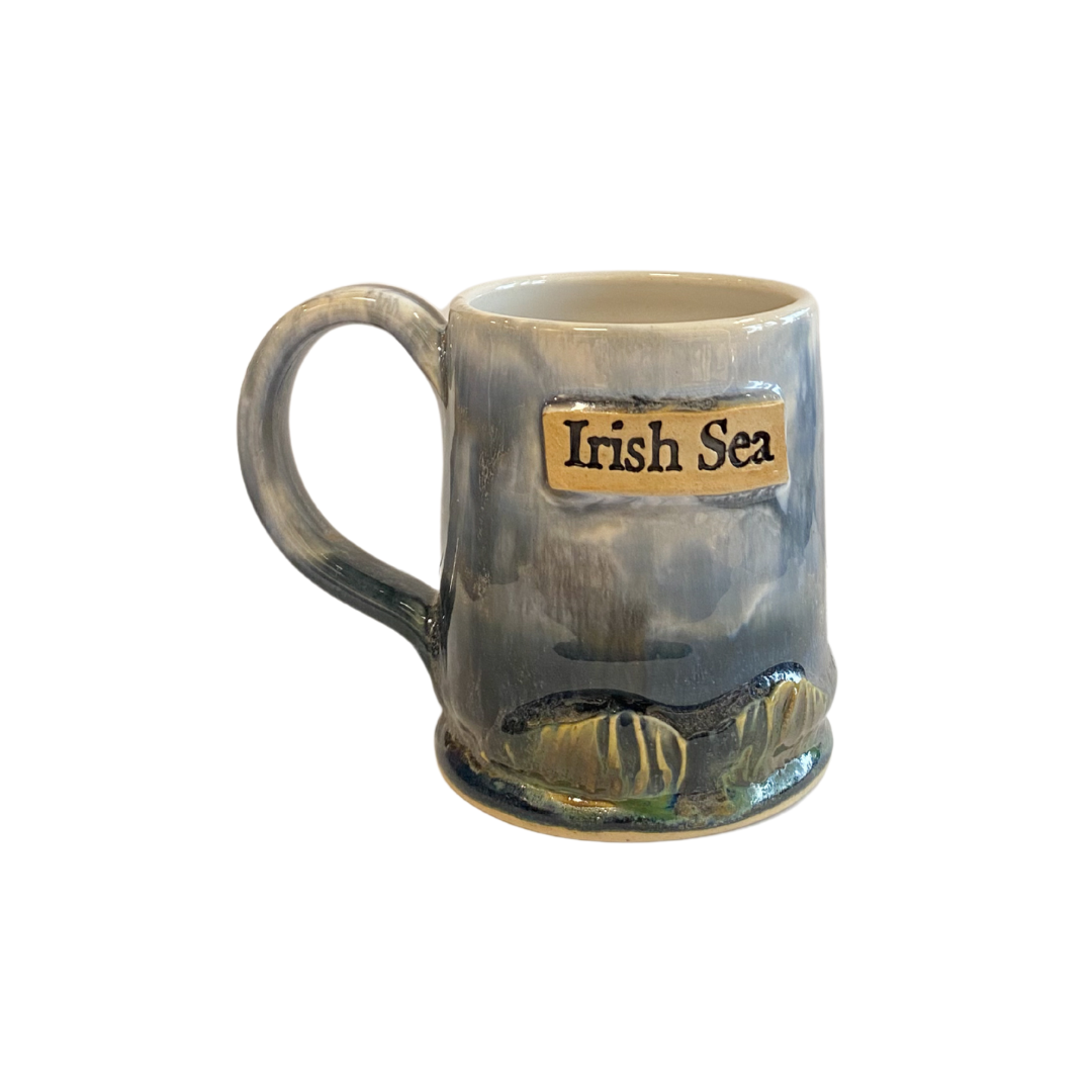 Ceramic mug with 'Irish Sea' text and design on a white background