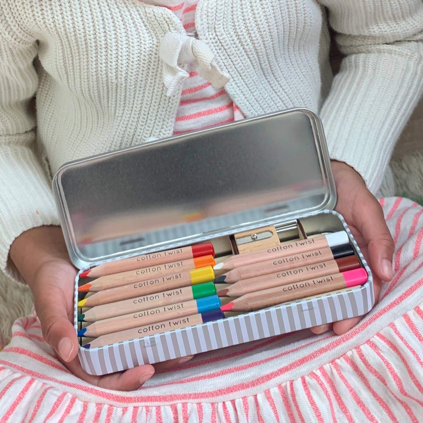 Jumbo Watercolour Pencils Tin - Rainbow being held by a child