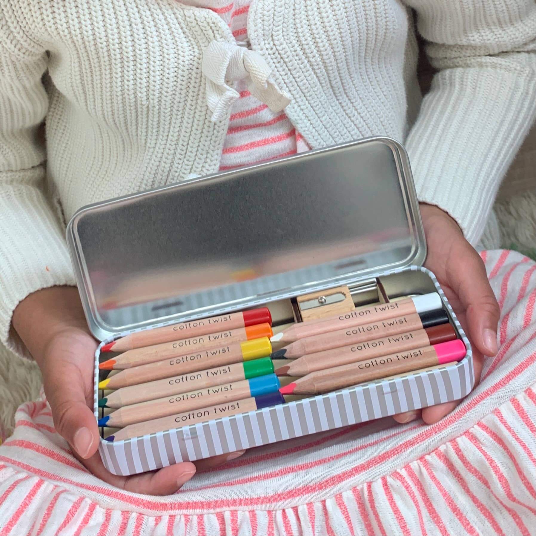 Jumbo Watercolour Pencils Tin - Rainbow being held by a child