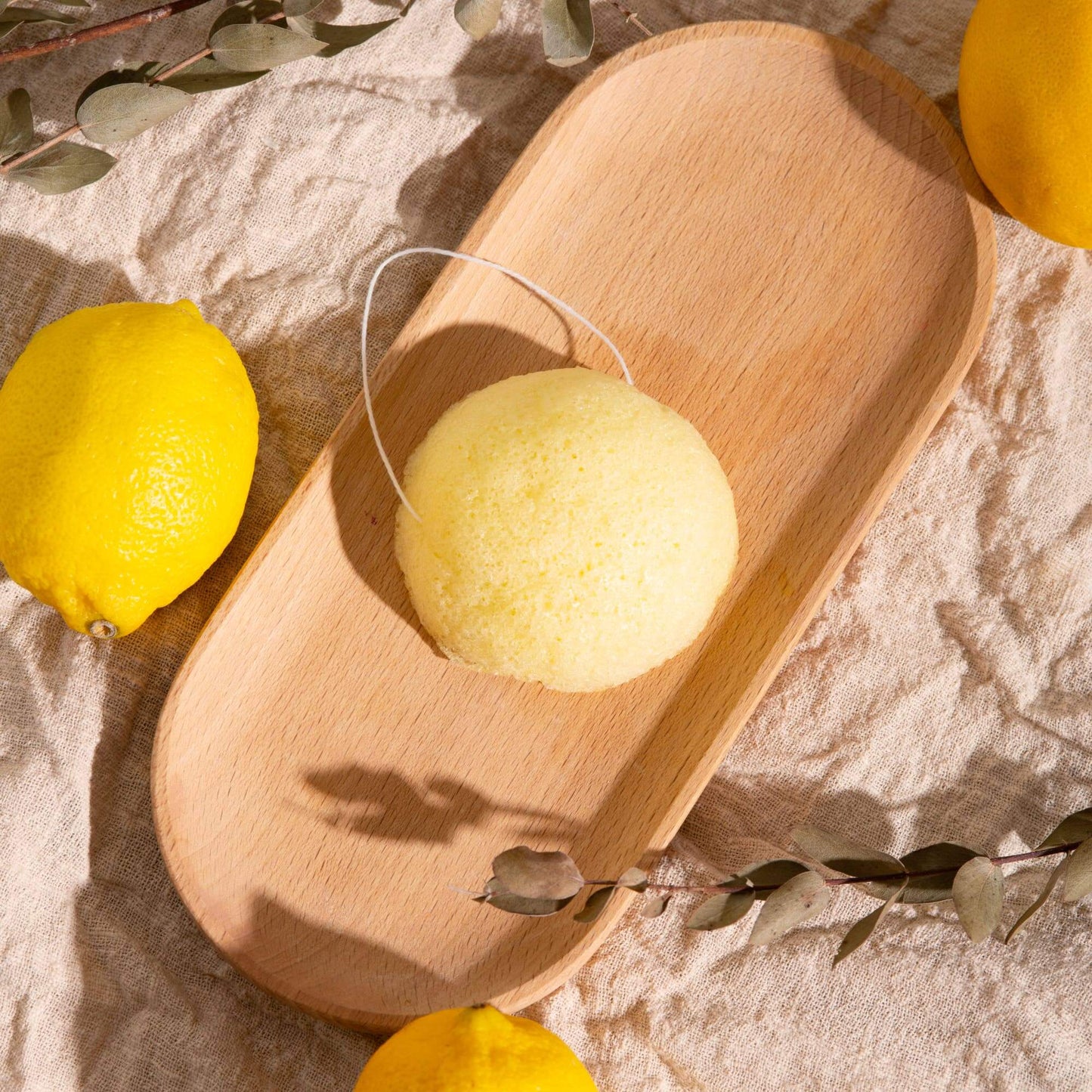 Konjac Face Sponge - Lemon on a tray
