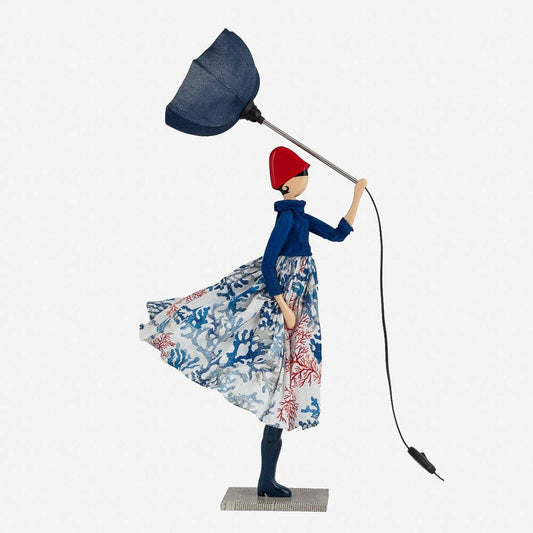 Decorative figure of a woman holding a lamp on a white background