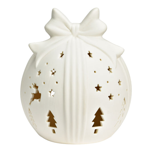 Decorative white lantern with cut-out Christmas designs on a white background