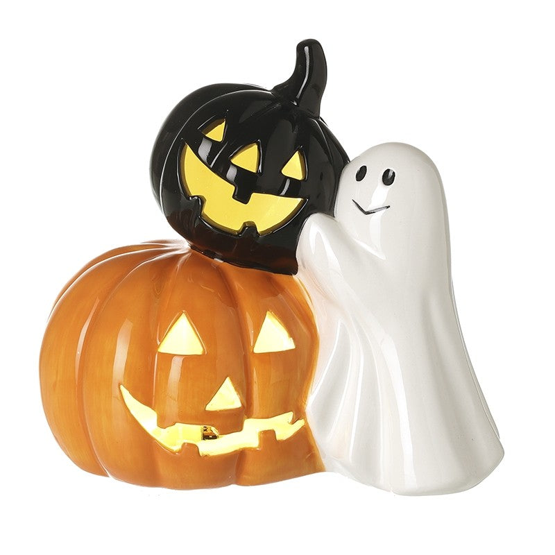 Halloween-themed ceramic figurine with a pumpkin and ghost on a white background
