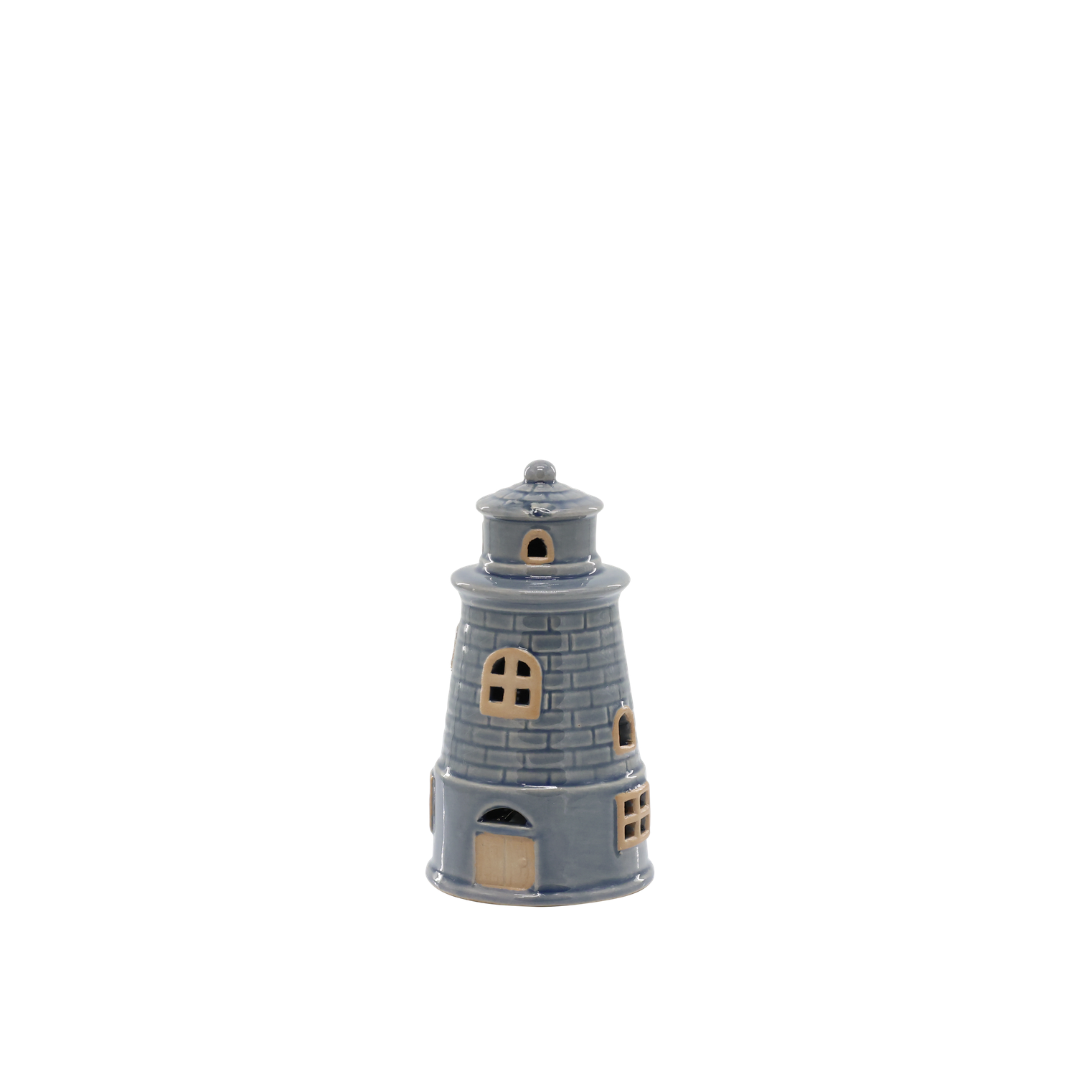 Small model of a lighthouse on a white background