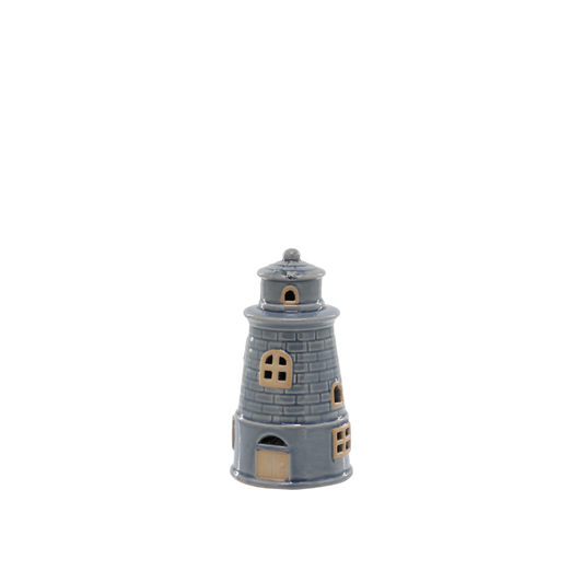 Small model of a lighthouse on a white background