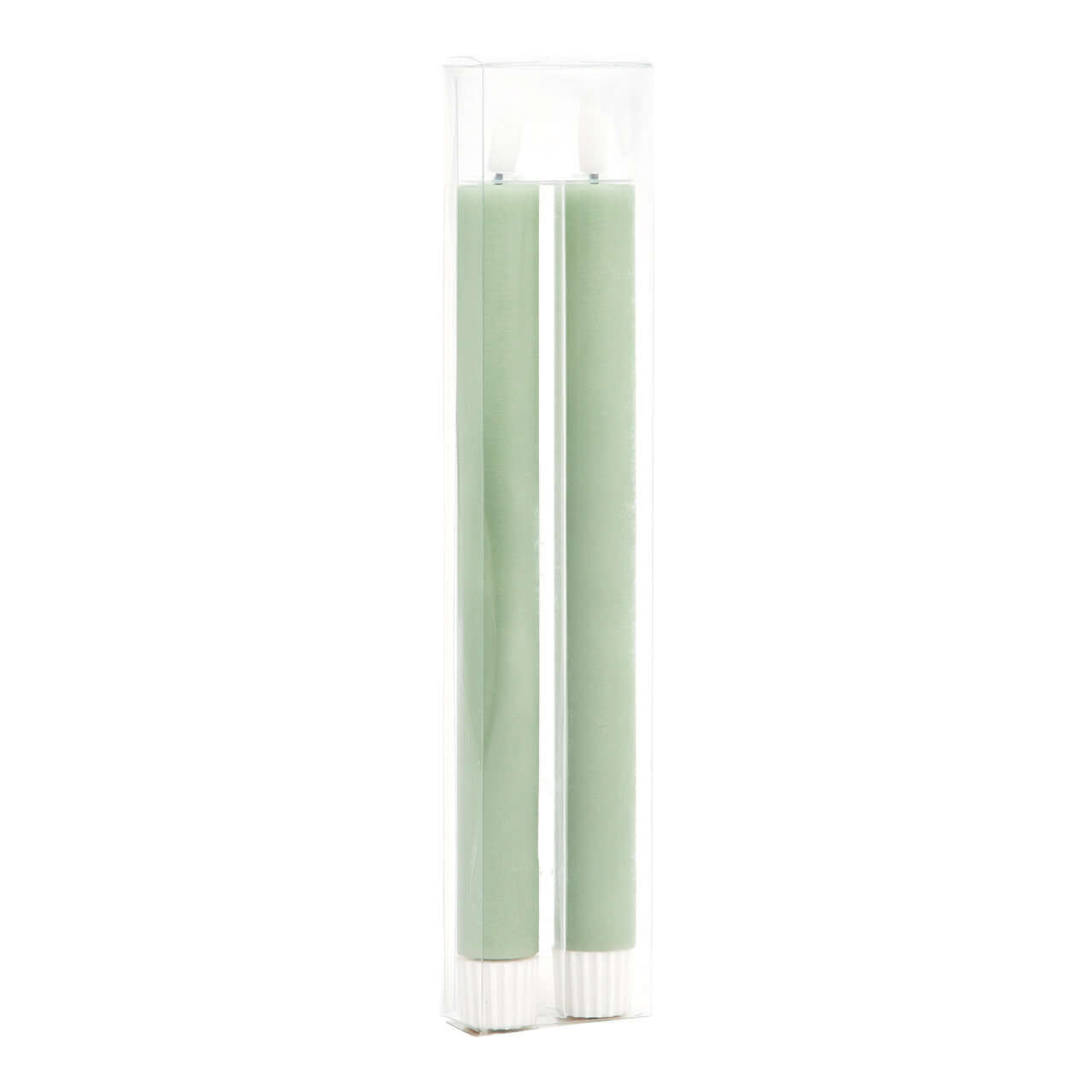 Two green candles in a clear glass holder on a white background