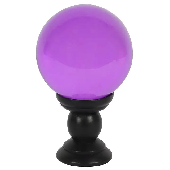 Purple glass sphere on a black stand against a white background