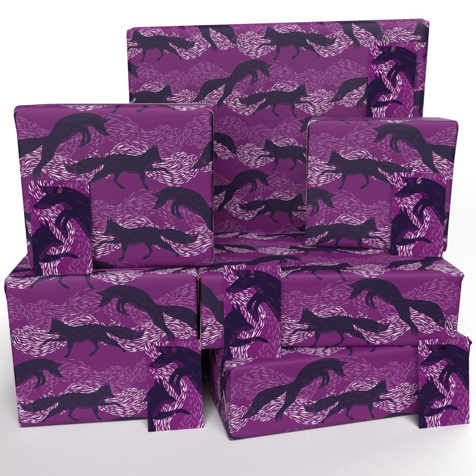 Stacks of purple wrapping paper with a fox pattern design.