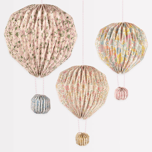 Set of decorative hot air balloons with floral patterns on a white background