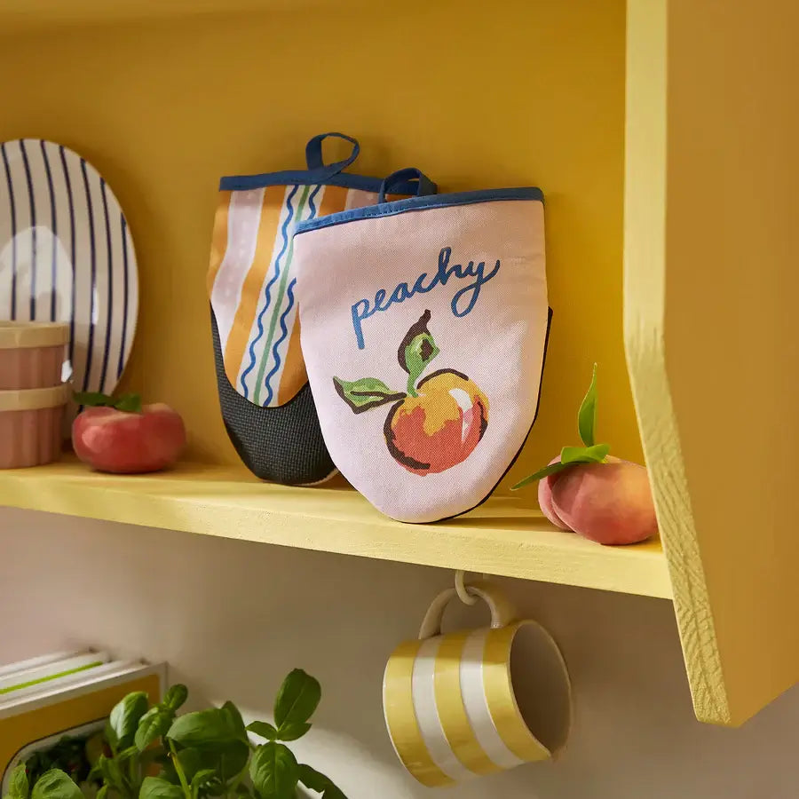 Life is Peachy Microwave Mitts on a table