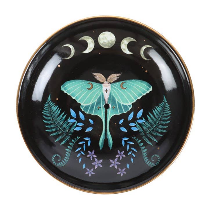 Decorative plate with a butterfly design on a black background