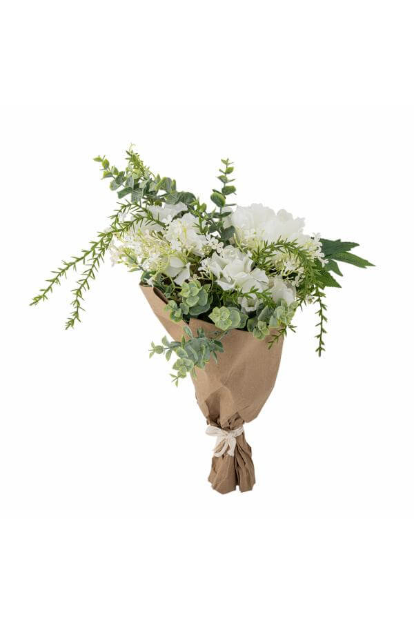 Bouquet of white flowers and greenery wrapped in brown paper on a white background