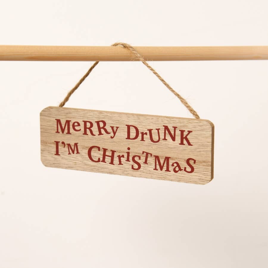 Wooden sign with 'Merry DrUNK I'm Christmas' text on a white background