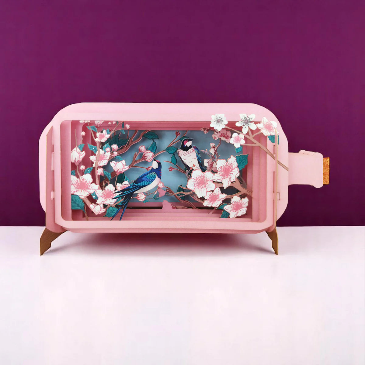 Pink pop up card with bird and cherry blossom design on a purple background
