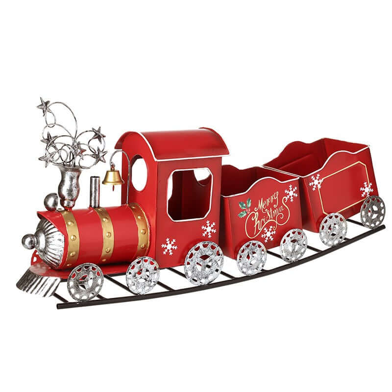 Red metal Christmas train with silver accents on a white background