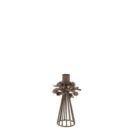 A rustic metal candle holder with a textured cylindrical top, leafy branch details, and a slatted conical base, shown against a plain white background.