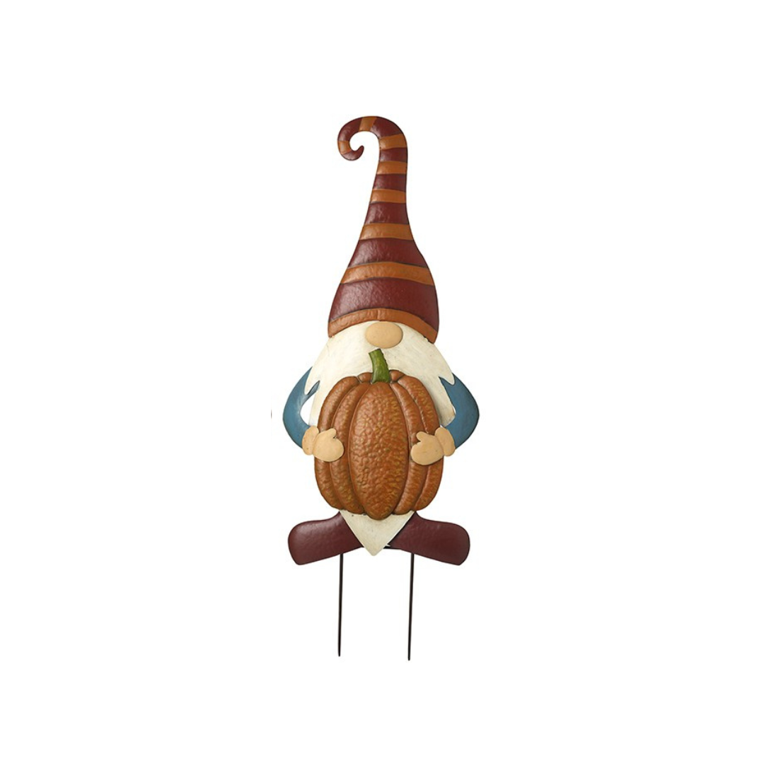 Gnome with striped hat holding a pumpkin on a white background