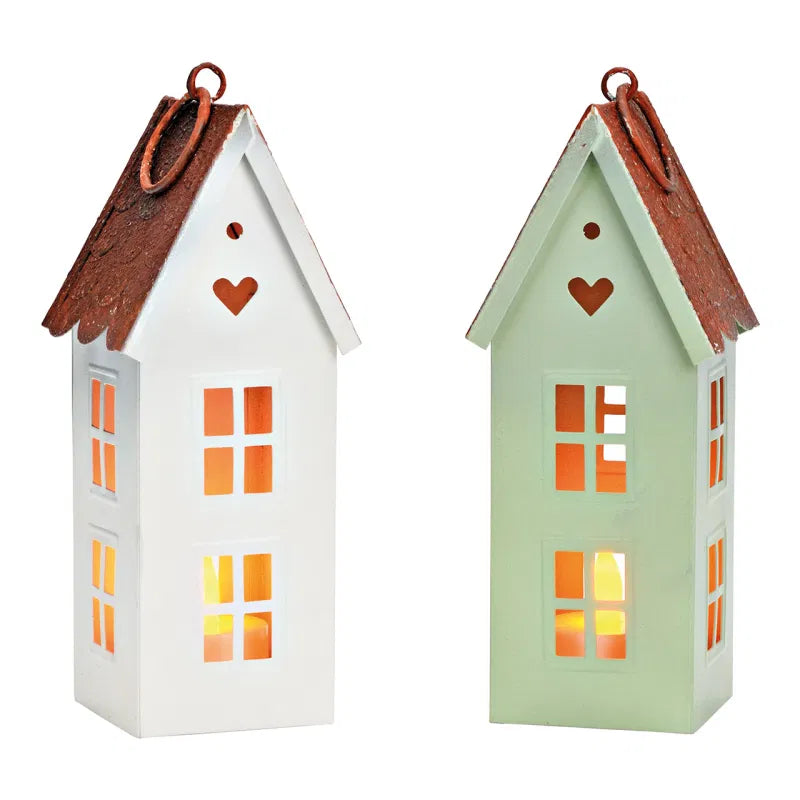 Two house-shaped lanterns with brown roofs on a white background
