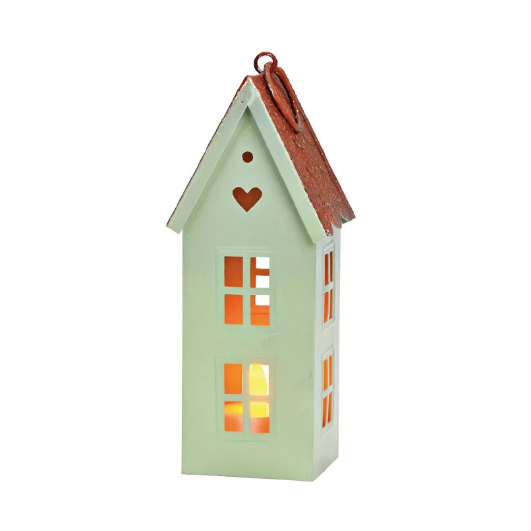 Decorative house-shaped lantern with a heart on a white background