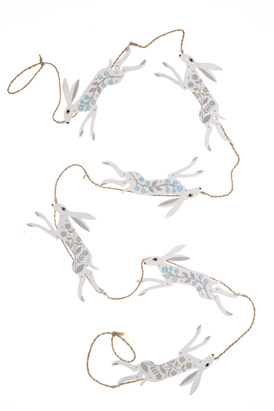 Decorative garland with white rabbit figures on a white background