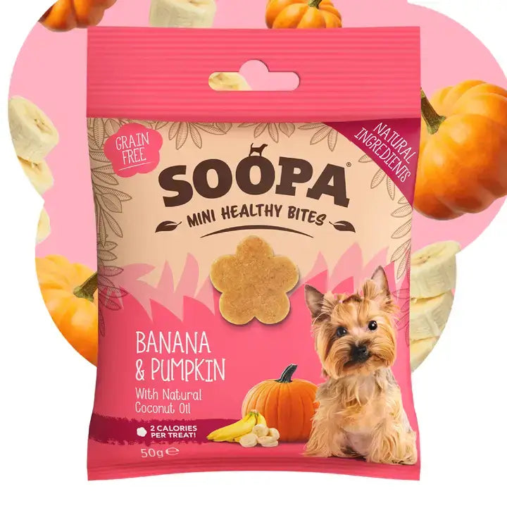 A package of Soopa Mini Healthy Bites dog treats, banana and pumpkin flavor, shown against a pink circular background decorated with pumpkin and banana illustrations.