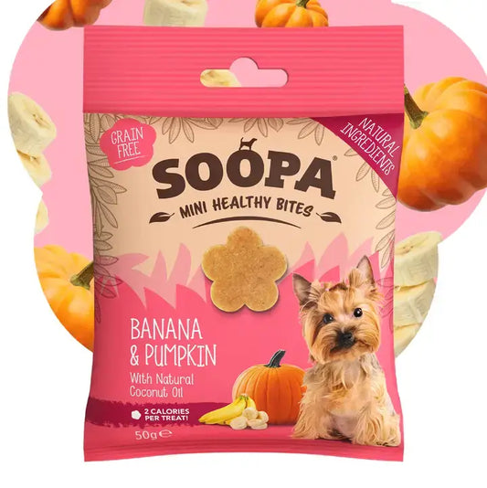 A package of Soopa Mini Healthy Bites dog treats, banana and pumpkin flavor, shown against a pink circular background decorated with pumpkin and banana illustrations.