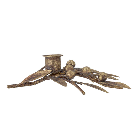 Decorative metal candle holder with leaves and berries elements on a white background