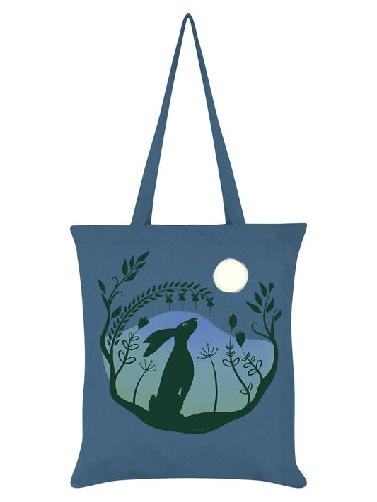 Blue tote bag with a silhouette of a hare and plants design on a white background