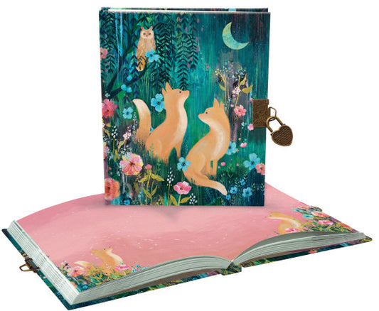 Decorative notebook with foxes and floral design on a white background