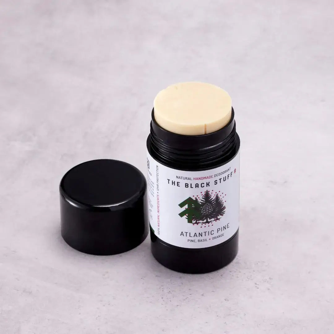 The Black Stuff Natural Deodorant - Atlantic Pine open container on a white background